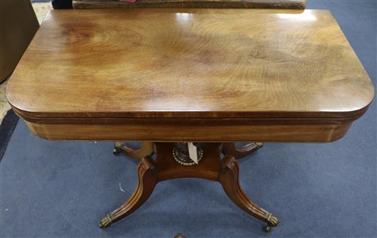 A Regency style folding mahogany tea table, W.92cm